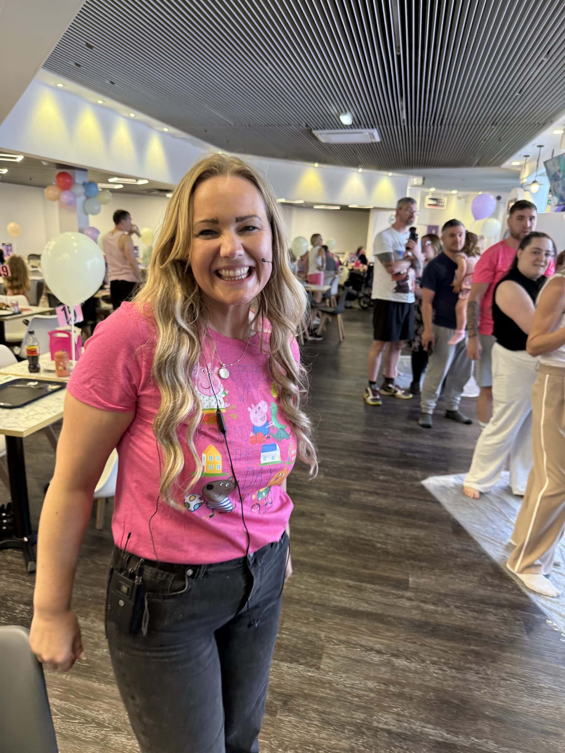 Event host with families and kids enjoying indoor party experience