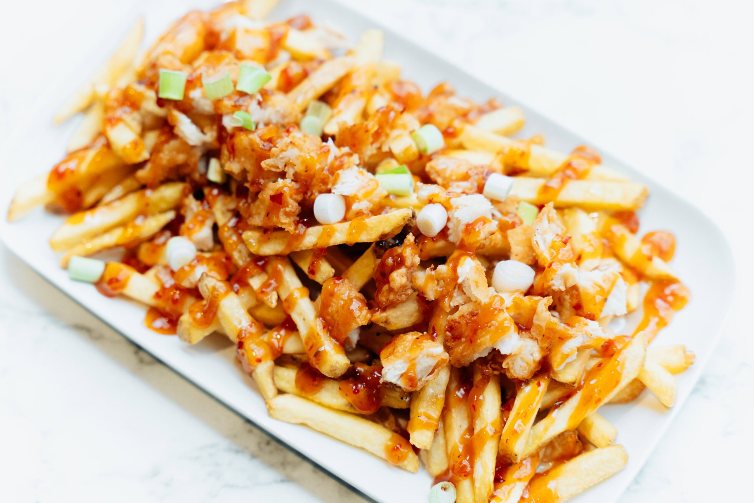Loaded fries with chicken and sauce kids menu food item