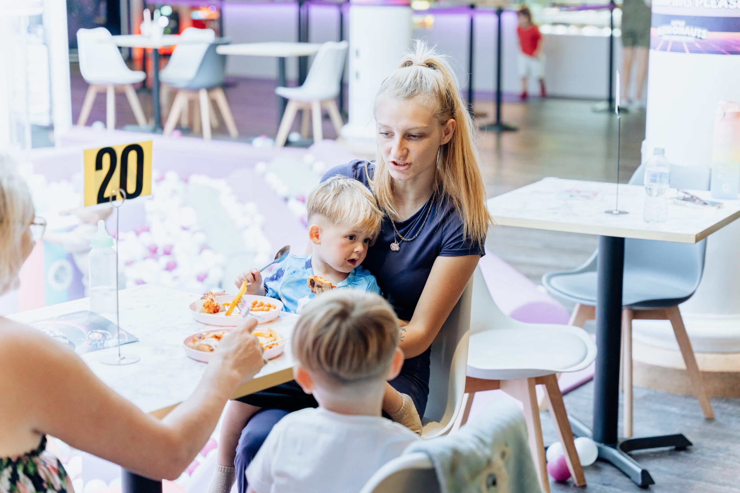 Parent and child enjoying meal in Little Astronauts family friendly play cafe