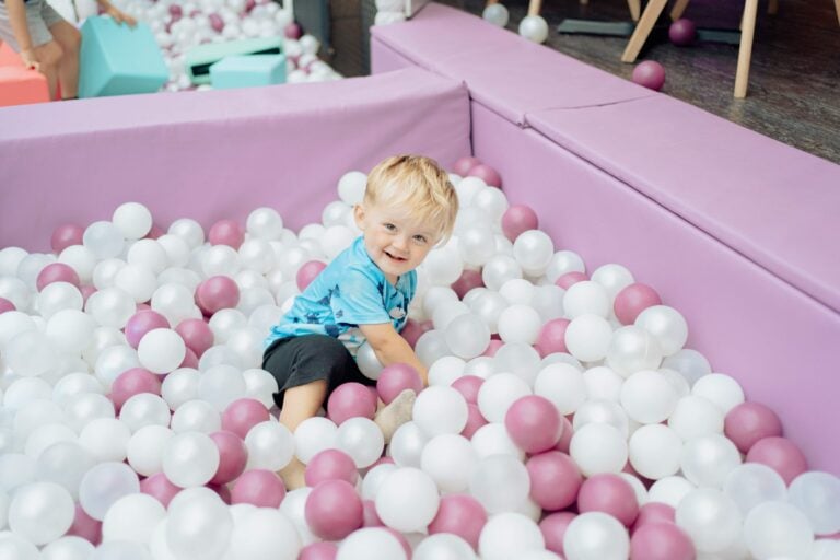 A toddler playing in the ball pool in the under 4s soft play zone in Hull