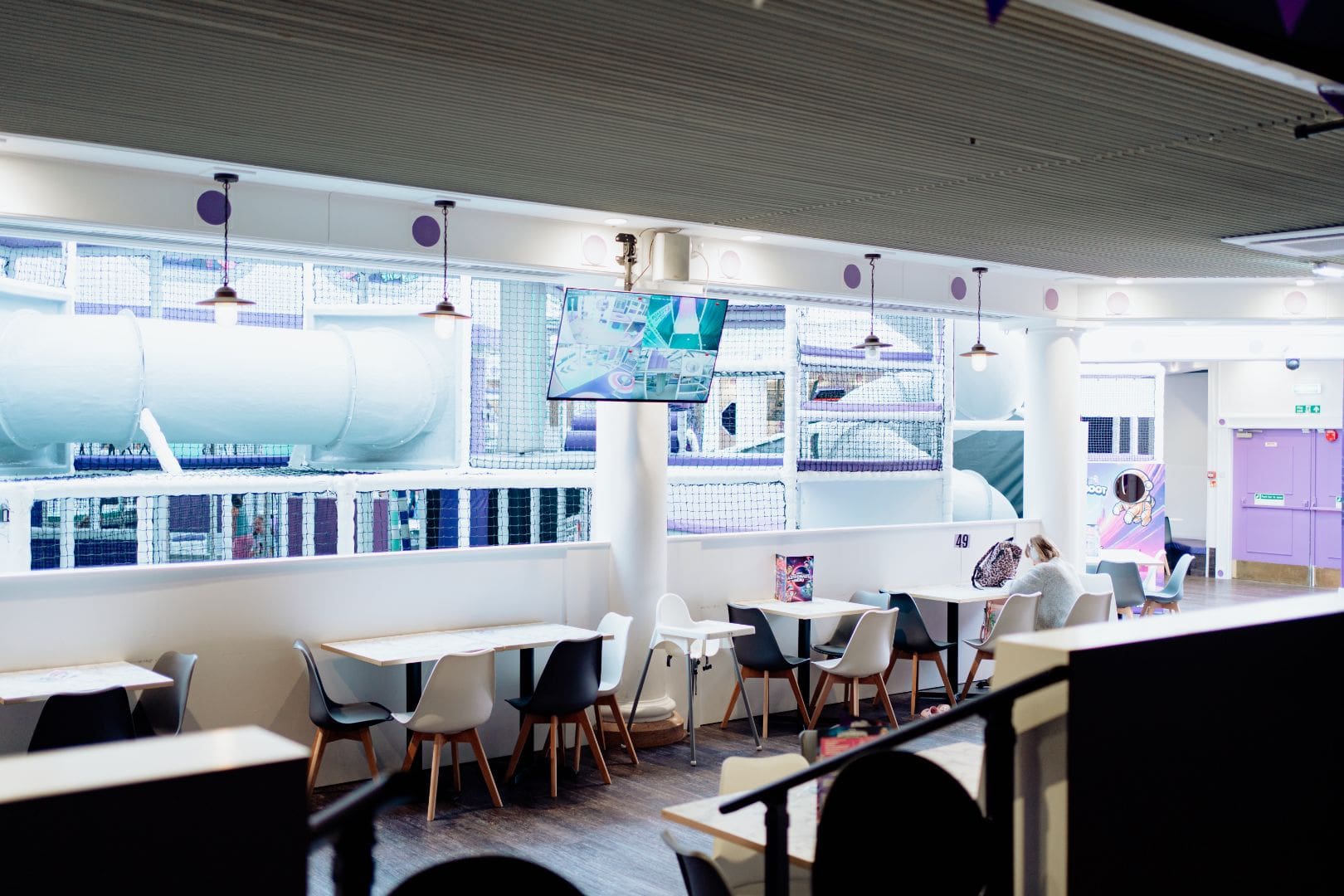 Indoor cafe seating and soft play area view for visitor information