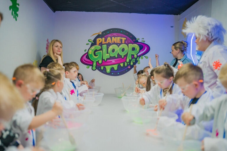 Hands stretching bright slime