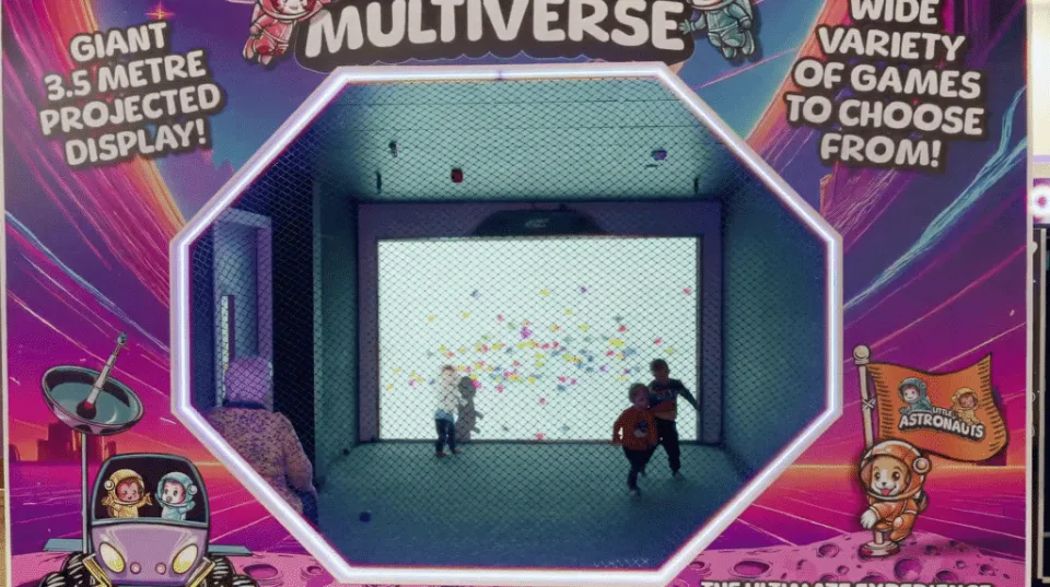 Children playing a game on the giant Multiverse projected screen